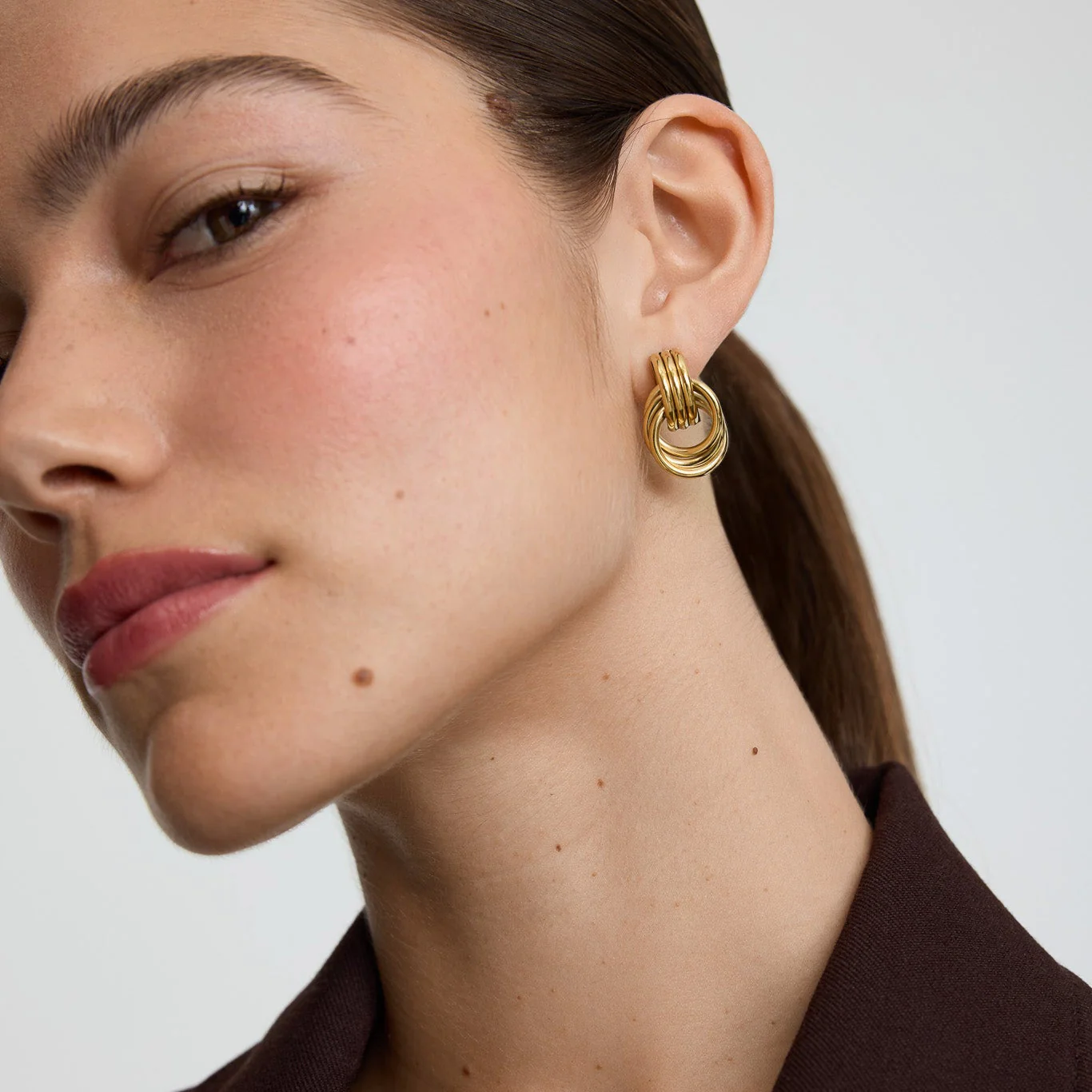 Gold Knot Statement Stud Earrings - Image 2